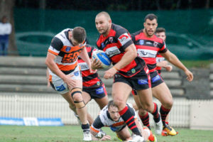 At prop for the Bears Robbie Rochow breaks away from the Wests Tigers defence. Photo Steve Little www.redandblackzone.com.