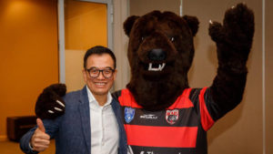 Image: Businessman Harry Cheung with the Bears mascot at Norths.